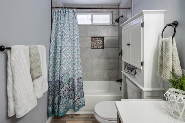 full bathroom featuring hardwood / wood-style floors, vanity, toilet, and shower / bath combination with curtain