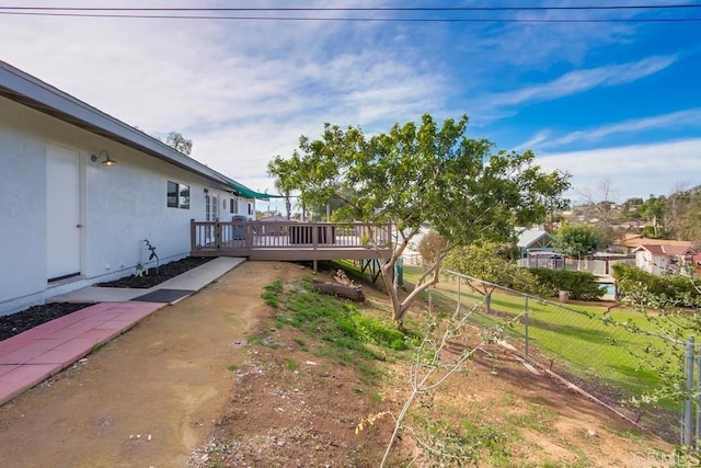 view of yard with a wooden deck