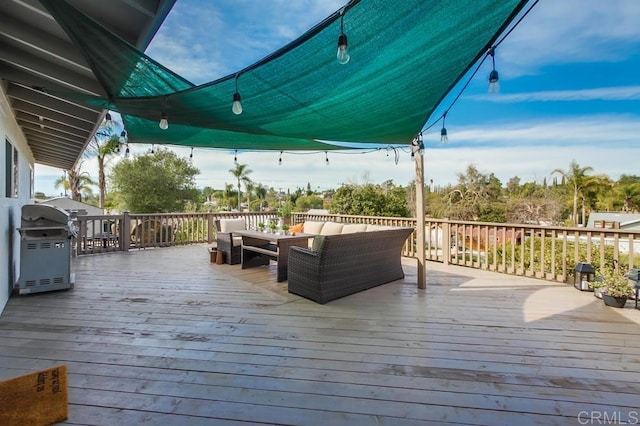 deck featuring an outdoor hangout area and area for grilling