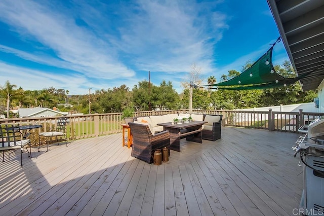 wooden terrace featuring an outdoor hangout area