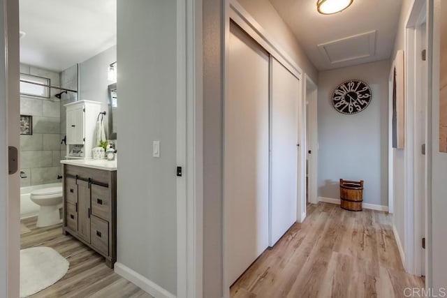 corridor featuring light hardwood / wood-style flooring