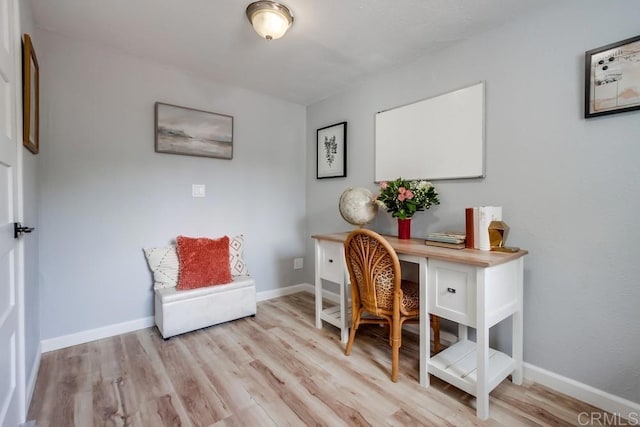 office space with light hardwood / wood-style floors