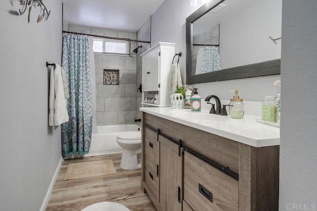 full bathroom featuring shower / tub combo, vanity, toilet, and wood-type flooring