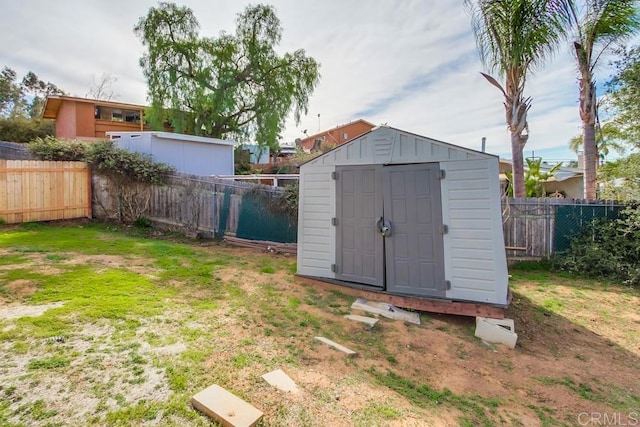 view of outbuilding with a yard