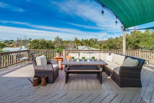 wooden deck featuring an outdoor living space