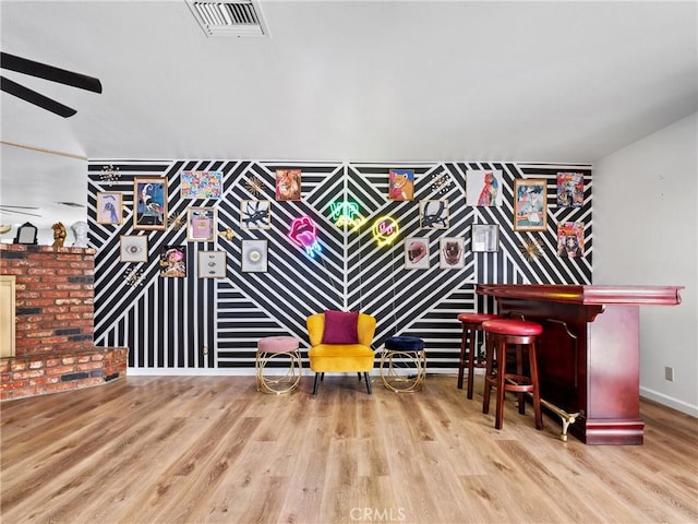 living area with hardwood / wood-style floors