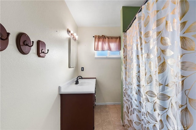 bathroom with a shower with curtain and vanity