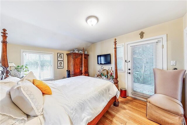 17407 Cantara St, Northridge, CA 91325 - bedroom featuring vaulted ceiling, access to exterior, and light wood finished floors