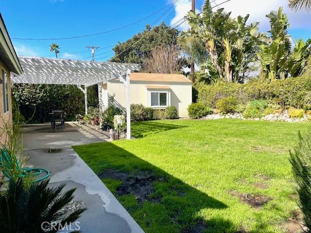 17407 Cantara St, Northridge, CA 91325 - view of grassy yard featuring a patio area