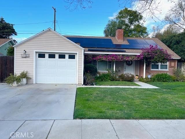 17407 Cantara St, Northridge, CA 91325 - single story home with a chimney, a front lawn, solar panels, driveway, and an attached garage