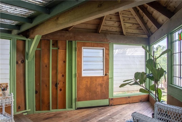 exterior space featuring wooden ceiling and vaulted ceiling with beams