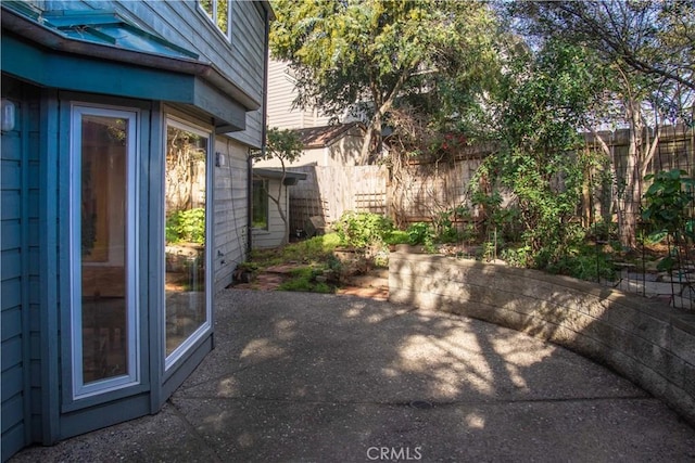 exterior space featuring a fenced backyard and a patio