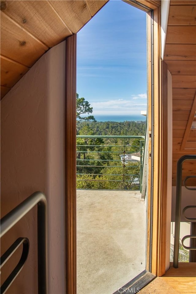 doorway with wood ceiling