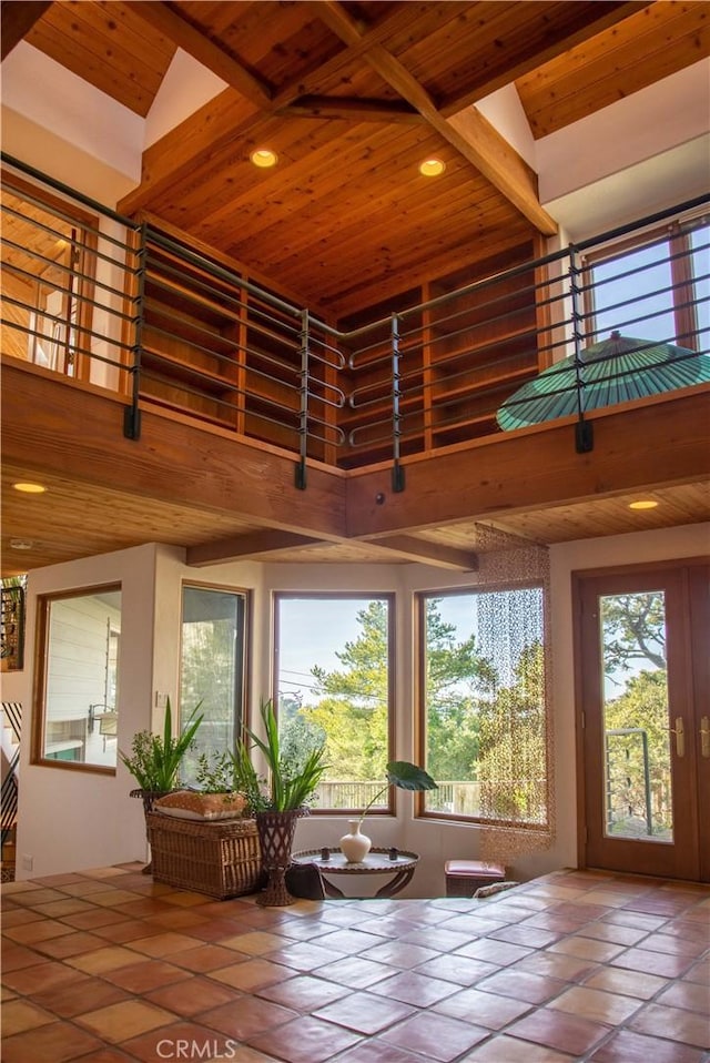 unfurnished sunroom with wooden ceiling