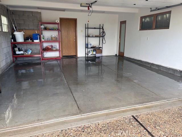 garage with concrete block wall