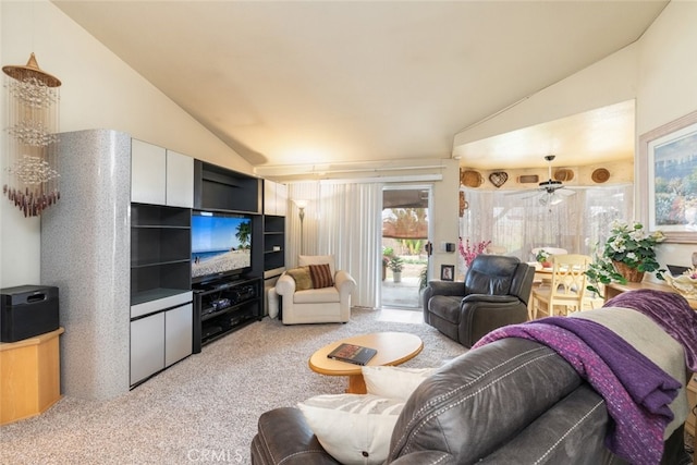 living area with lofted ceiling and light colored carpet