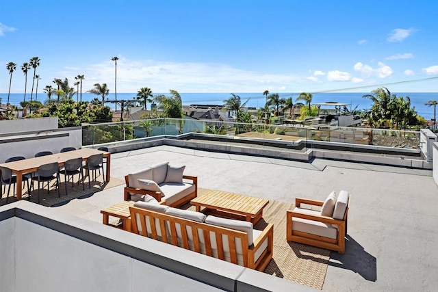 view of patio / terrace with a water view and an outdoor living space