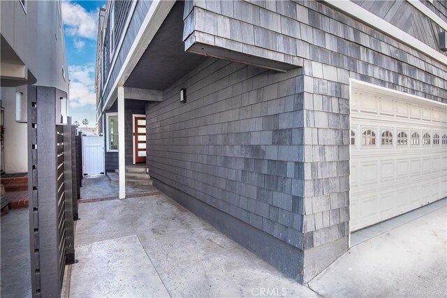 16791 Bayview Dr, Huntington Beach, CA 92649 - view of side of home featuring a garage
