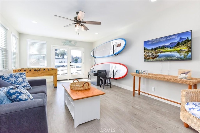 16791 Bayview Dr, Huntington Beach, CA 92649 - living area with wood finished floors, ceiling fan, recessed lighting, and baseboards