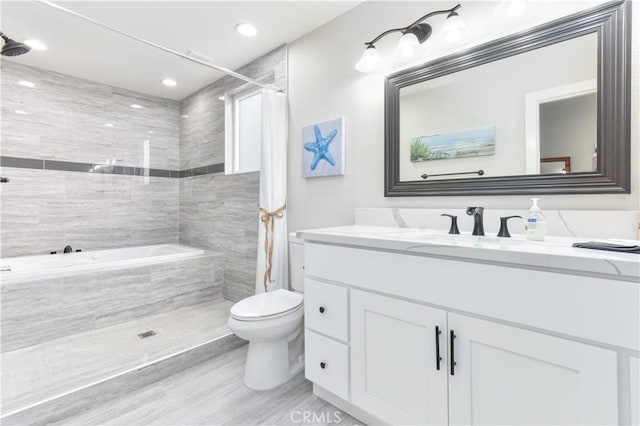 16791 Bayview Dr, Huntington Beach, CA 92649 - bathroom with vanity, tiled shower, toilet, a bathtub, and recessed lighting