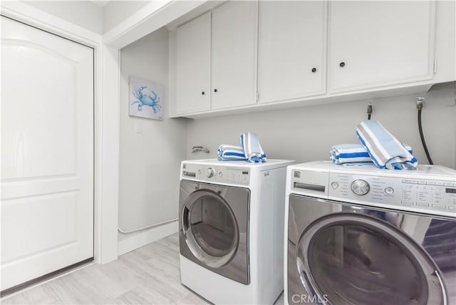 16791 Bayview Dr, Huntington Beach, CA 92649 - washroom featuring cabinet space and washing machine and clothes dryer
