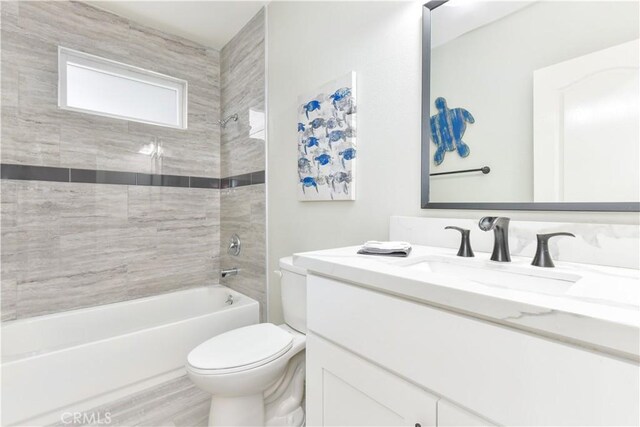 16791 Bayview Dr, Huntington Beach, CA 92649 - bathroom with toilet,  shower combination, and vanity