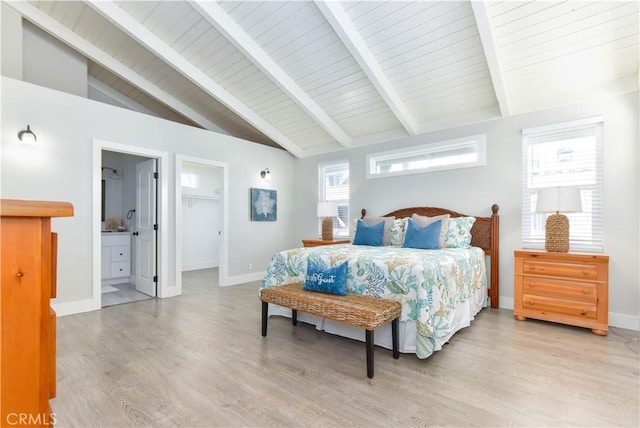 16791 Bayview Dr, Huntington Beach, CA 92649 - bedroom with light wood-style flooring, baseboards, and a walk in closet