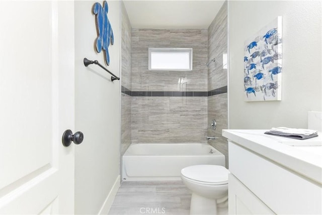 16791 Bayview Dr, Huntington Beach, CA 92649 - full bathroom with tub / shower combination, toilet, baseboards, wood finished floors, and vanity