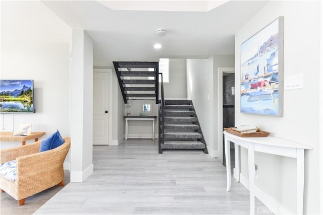16791 Bayview Dr, Huntington Beach, CA 92649 - staircase with wood finished floors and baseboards
