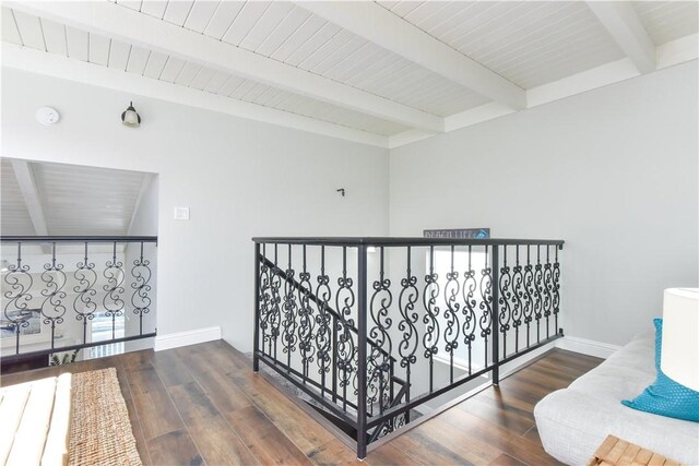 16791 Bayview Dr, Huntington Beach, CA 92649 - hall with beamed ceiling, wood finished floors, baseboards, and an upstairs landing