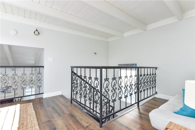 16791 Bayview Dr, Huntington Beach, CA 92649 - hall with beamed ceiling, wood finished floors, baseboards, and an upstairs landing