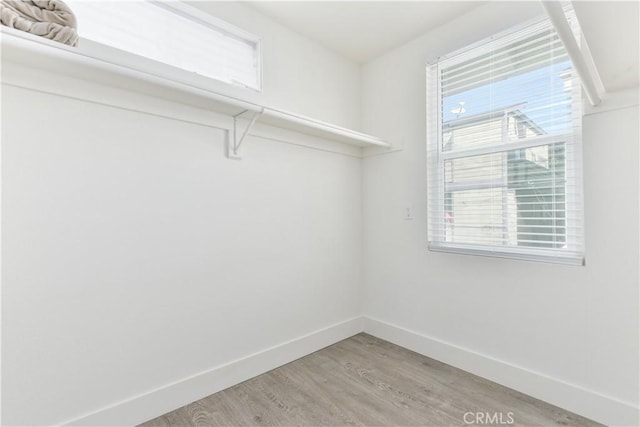 16791 Bayview Dr, Huntington Beach, CA 92649 - walk in closet featuring light wood finished floors