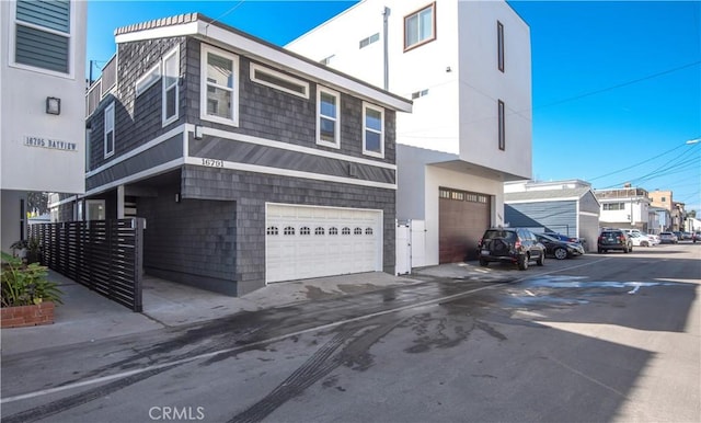 16791 Bayview Dr, Huntington Beach, CA 92649 - view of front of home featuring a garage