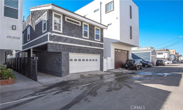 16791 Bayview Dr, Huntington Beach, CA 92649 - view of side of home featuring a garage