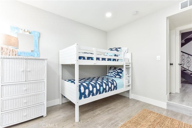 16791 Bayview Dr, Huntington Beach, CA 92649 - bedroom with wood finished floors and baseboards