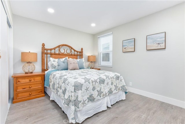 16791 Bayview Dr, Huntington Beach, CA 92649 - bedroom featuring light wood-style flooring, baseboards, recessed lighting, and a closet