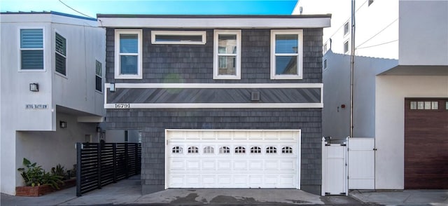 16791 Bayview Dr, Huntington Beach, CA 92649 - view of front of home with a garage and fence
