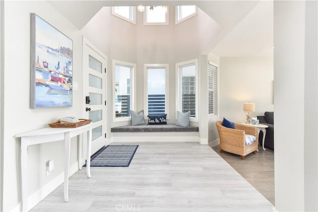 16791 Bayview Dr, Huntington Beach, CA 92649 - entryway with wood finished floors and a high ceiling