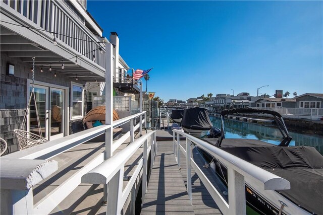 16791 Bayview Dr, Huntington Beach, CA 92649 - dock featuring a balcony and a water view