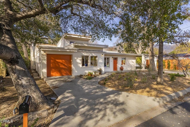 view of front of home with concrete driveway