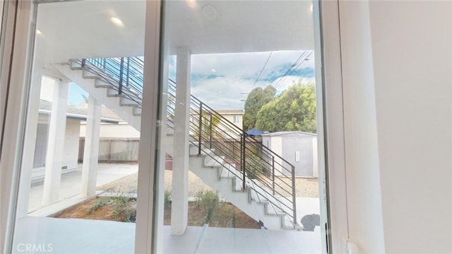 entryway featuring stairs and plenty of natural light