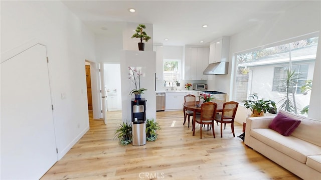 living area featuring a toaster, recessed lighting, and light wood-style floors