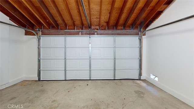 garage featuring baseboards