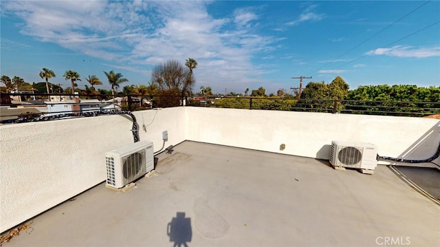 view of patio with a balcony and ac unit