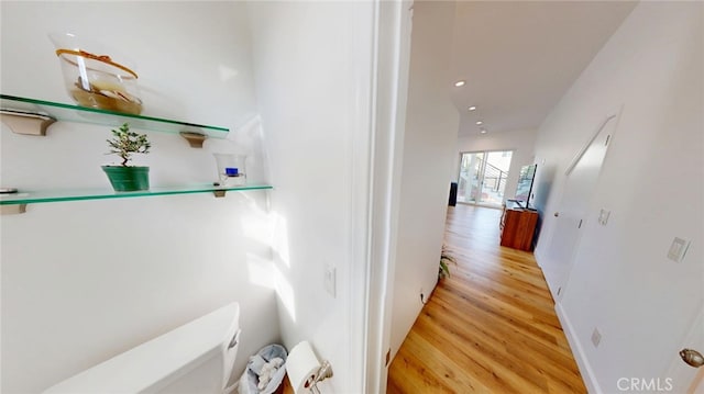 hallway featuring recessed lighting and light wood-style floors