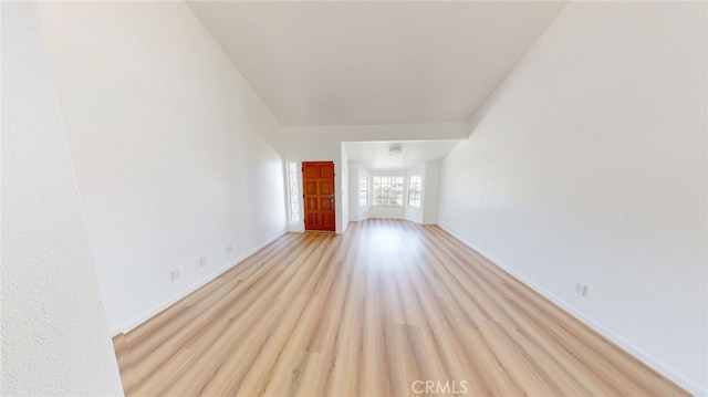 unfurnished living room with light wood-style flooring