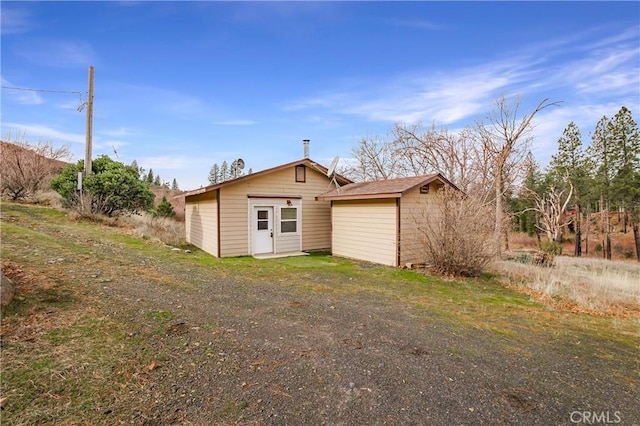 exterior space featuring a storage unit