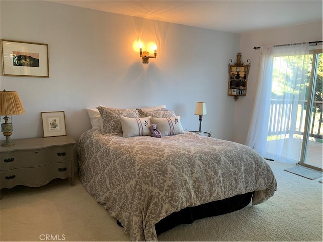 carpeted bedroom featuring access to outside