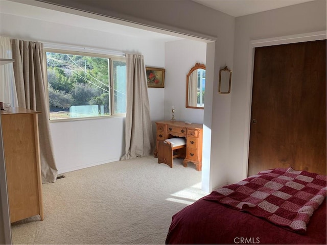 bedroom with light carpet