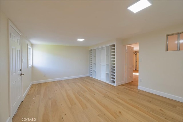 unfurnished bedroom with light wood-type flooring